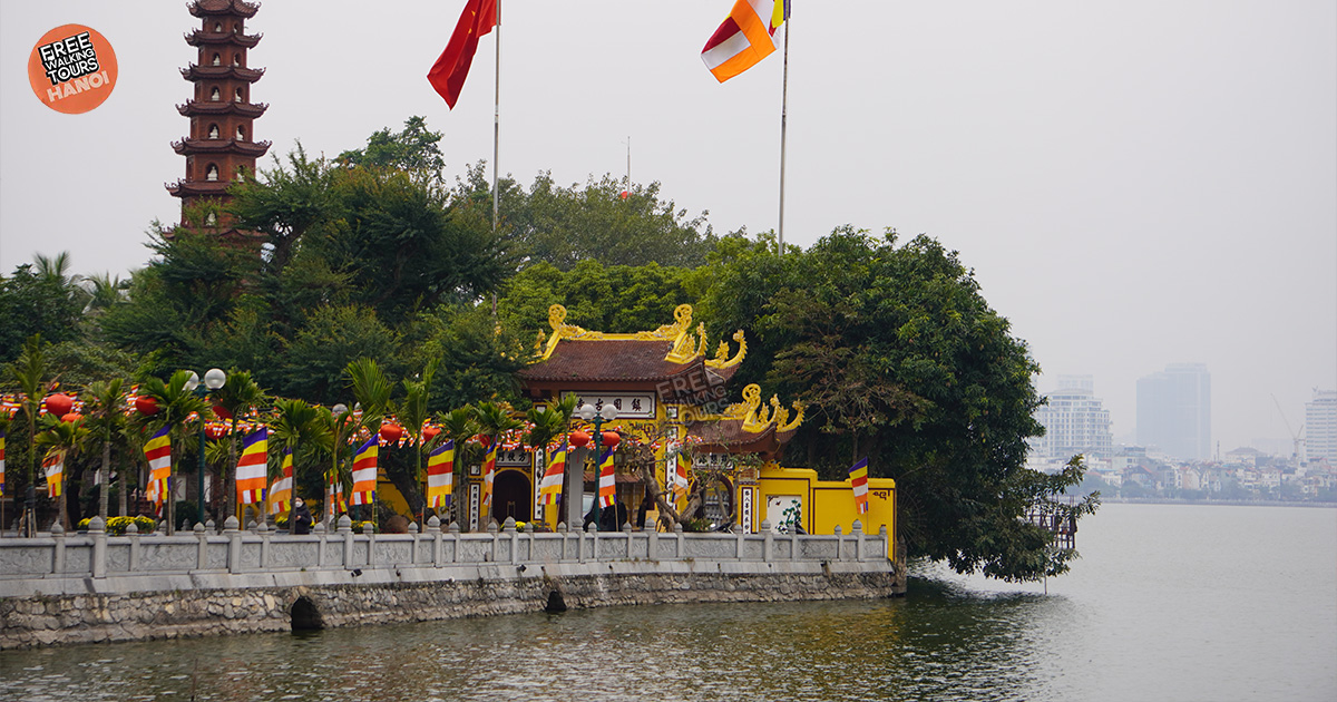 Tran Quoc Pagoda framed by sunset skies over West Lake Hanoi